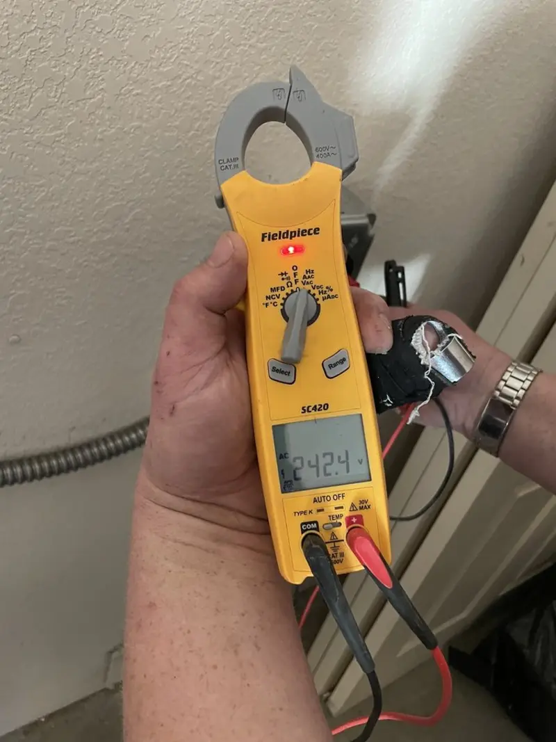 Voltage testing with clamp meter during Outlet Installation in Smithfield